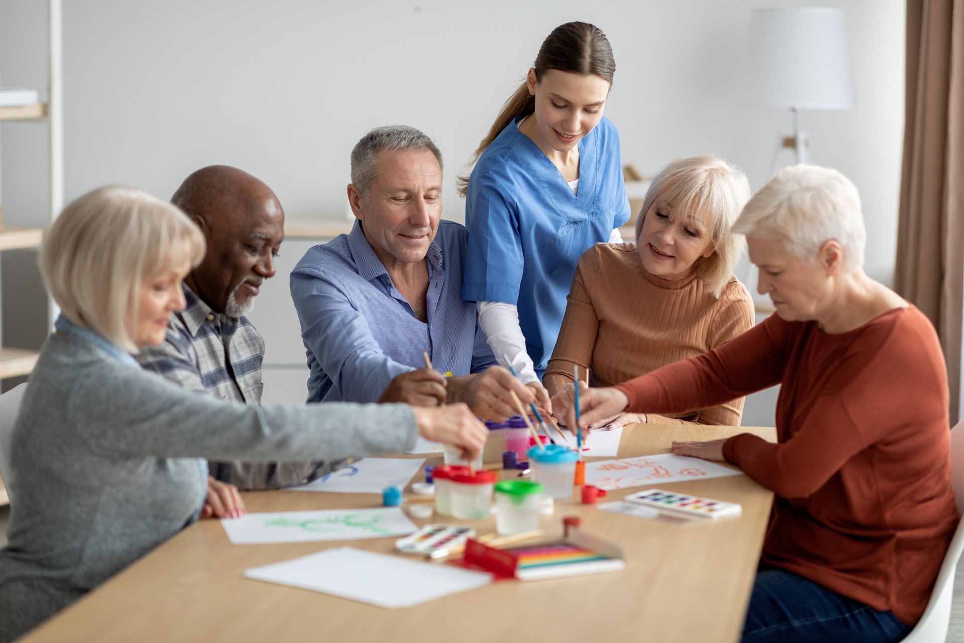 International group of senior people having painting activity